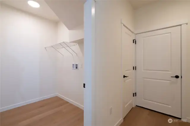 Primary dwelling utility room and door to garage.