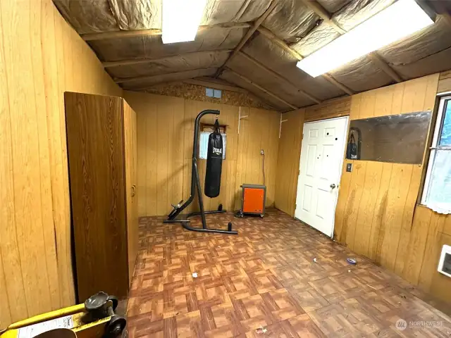 Inside the "tiny house". Note the cadette heater on the wall.