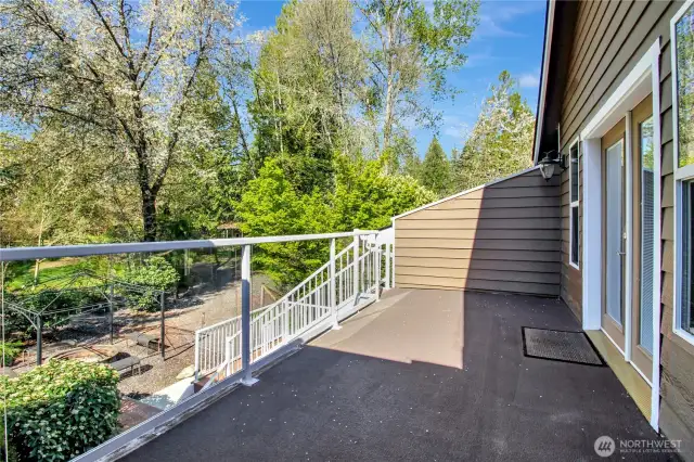 Deck off bonus room has stairs to patio