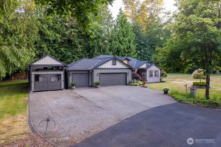 Seculded home nestled on 1.3 acres, extra building for your RV