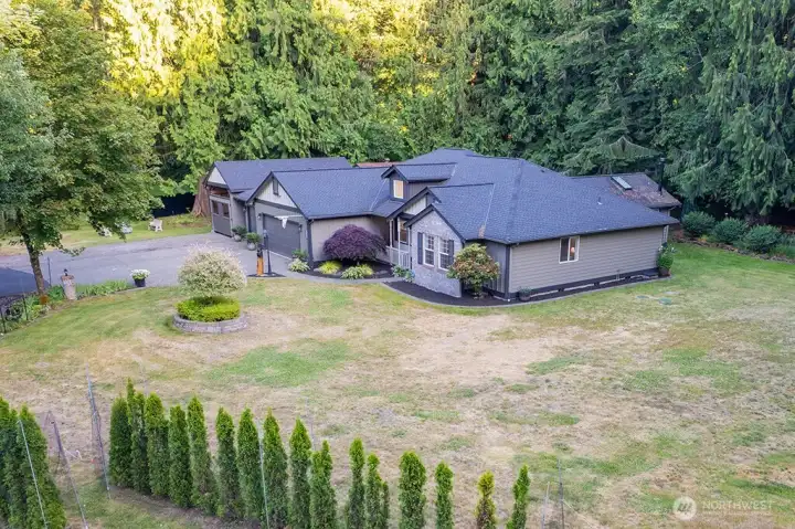 Aerial view of home on 1.3 acres