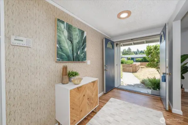 Step through grand double doors into a welcoming entryway that sets the tone for the rest of the home
