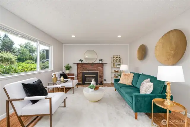 The living area glows with natural light, offering a warm and inviting space to unwind or entertain.  You could add french doors for a classic touch.