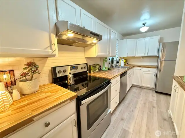 Compact galley kitchen with new countertops