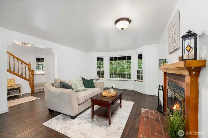 Living room with beautiful bay windows.