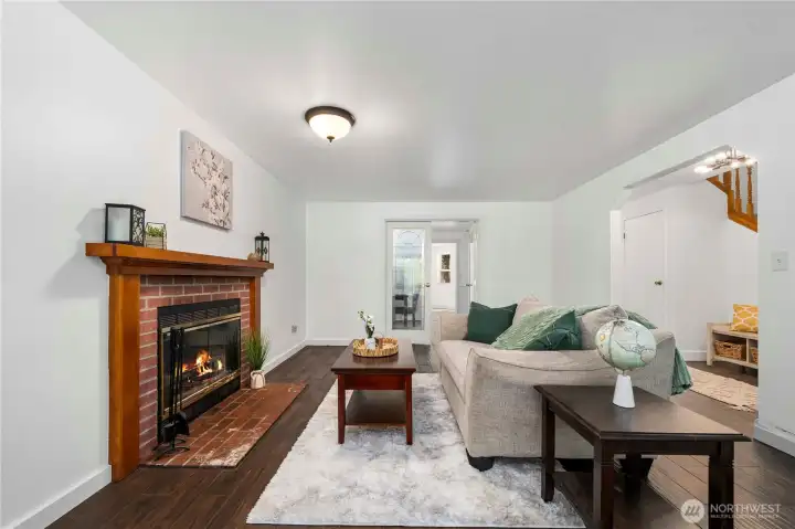 Living room with French doors to designated dining room.