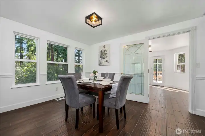 Dining room with easy access to kitchen and additional dining space.