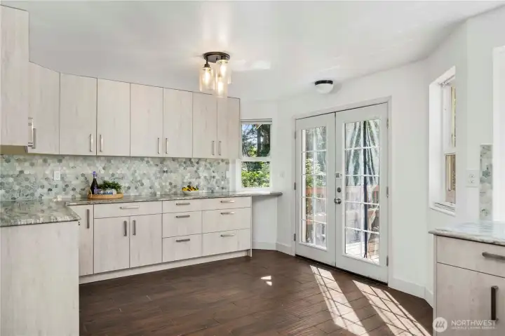 Additional storage in breakfast nook with double doors leading to back deck.