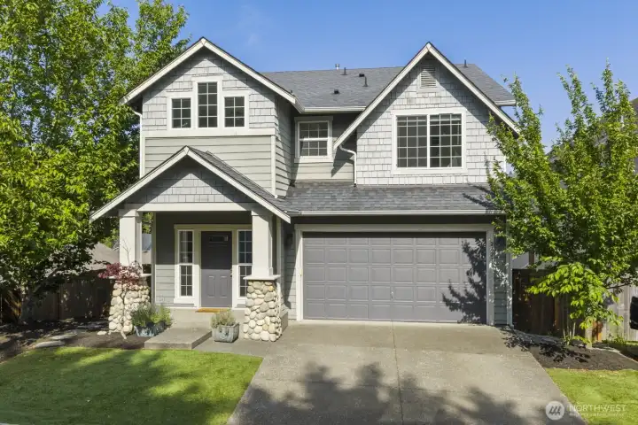 Low-maintenance turf front yard with space for natural trees and plants to create shade and enhance curb appeal.