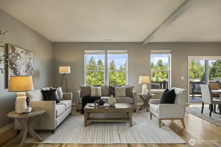 Picture-perfect living room with abundant windows, filling the space with natural light.( staged photo)