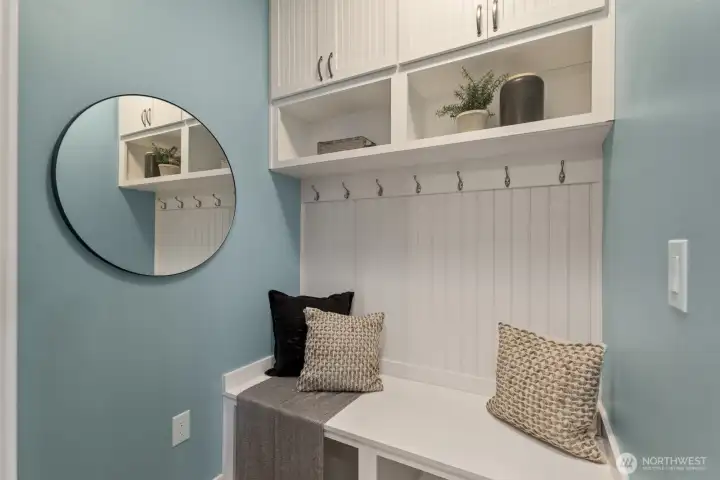 Beautiful mudroom designed for winding down and staying organized right after entering from the garage.(staged pic)