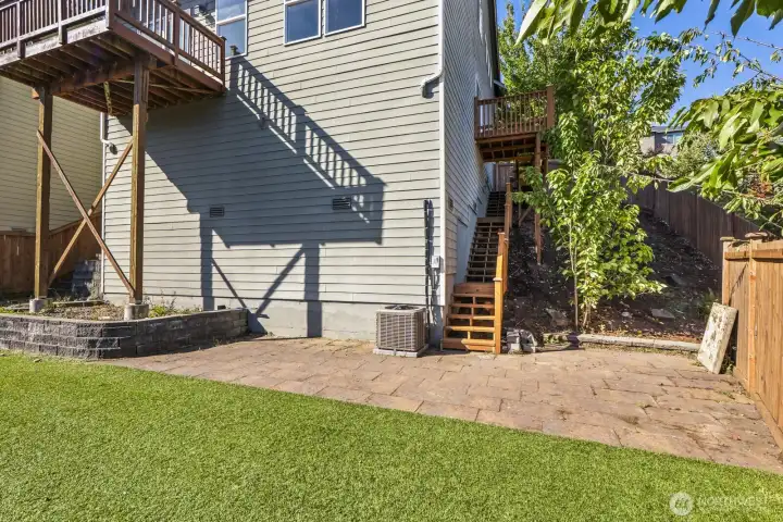 Newly added side deck offers convenient access from the home to the backyard.
