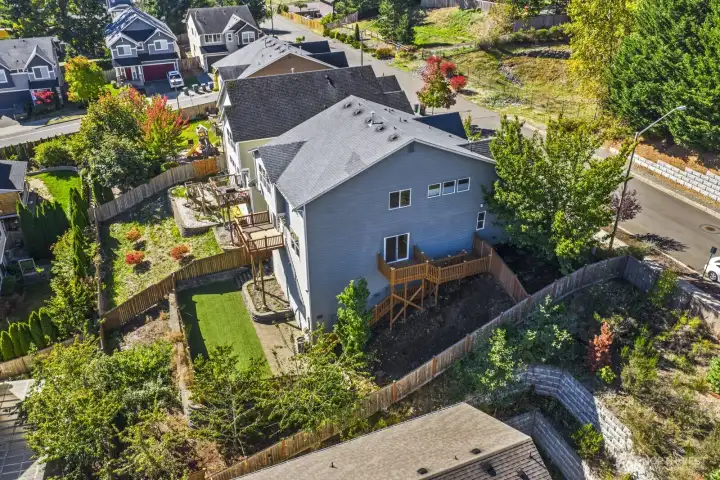 Beautiful new deck provides easy access to the fully fenced, low-maintenance turf backyard.