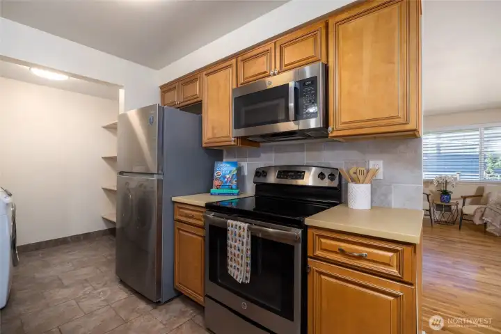 There is extra storage in the laundry room located off the kitchen.