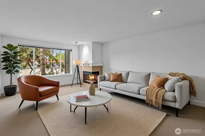 Enjoy the spacious living room with abundant natural light and wood burning fireplace. The owner has installed new carpet and professionally repainted the interior walls.  Nothing to do but move in.