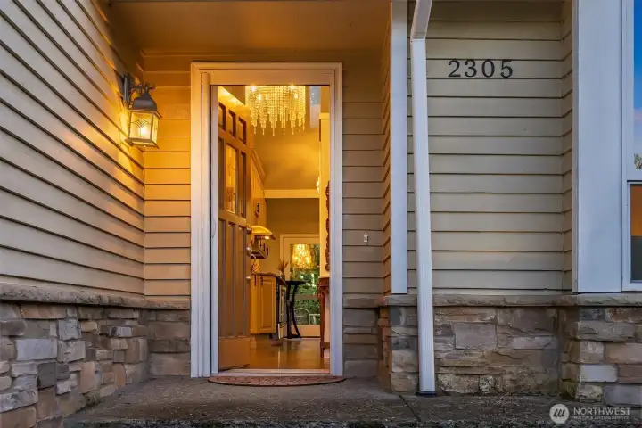 The warm, inviting warm wood entryway is the introduction to this meticulously maintained home.
