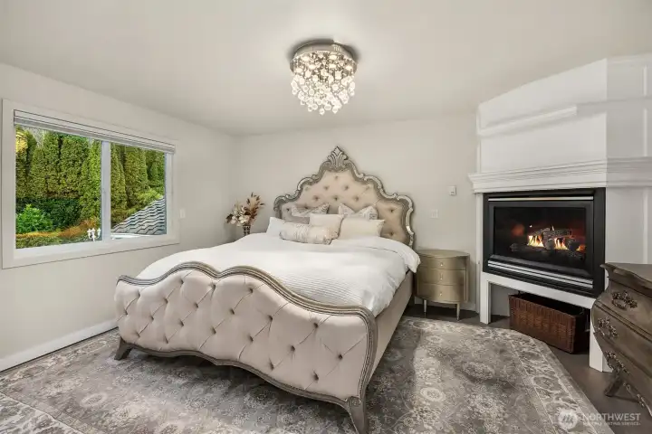 The upper primary suite is your personal sanctuary with gas fireplace, 5-pce, en suite bath and large walk-in closet. All bedrooms enjoy the beautiful luxury wood flooring.