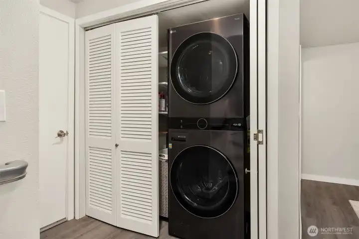 Full size washer and dryer, with storage space for all your laundry needs. Next door is the two-car garage.