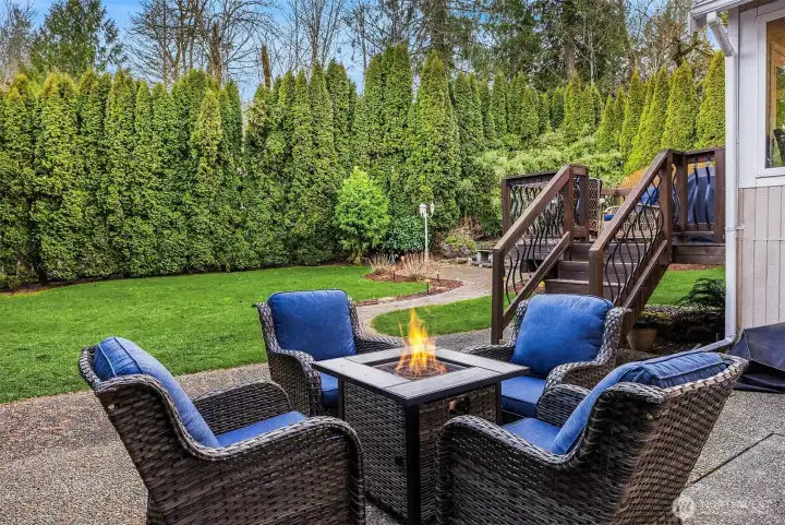 The back landscape offers a wonderful patio space, just off the kitchen deck.