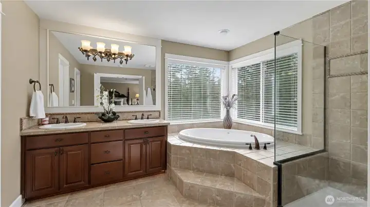 Double vanity with standalone bathtub and walk-in shower