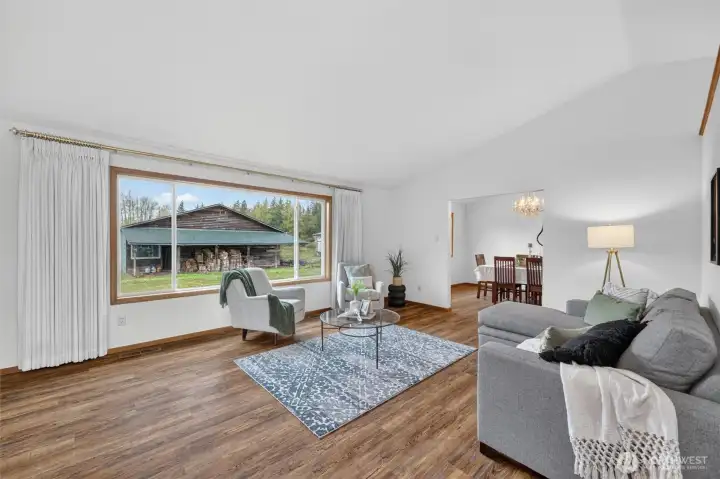 Large windows look out onto the property, with your shop visible in the background.