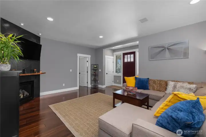 Main Home living room with gas fireplace and beautiful Brazilian floors.