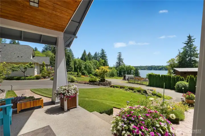 Main home craftsman style porch has views of the Water & Mtn.