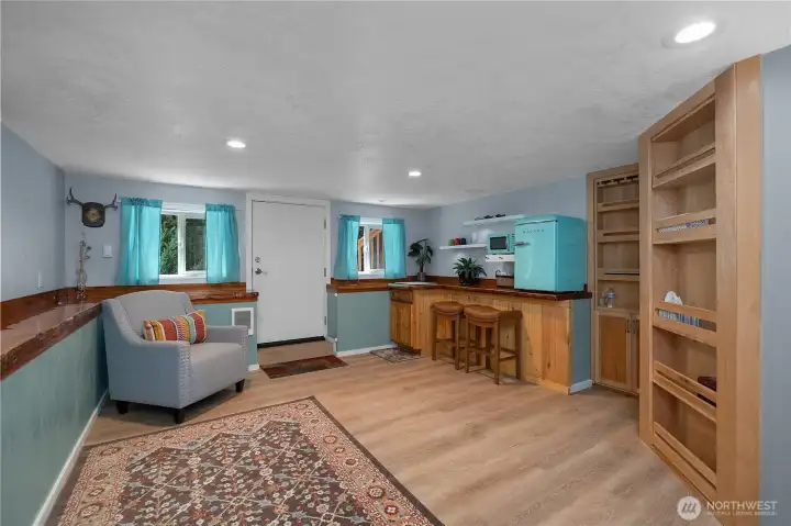 The lower-level private-entry flex space offers endless possibilities as a game room, poker room, craft studio, hobby room, fitness area, media lounge, or private retreat. Custom built-ins, hidden storage, and a concealed ¾ bath create a truly unique experience that must be seen to be appreciated.