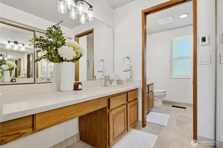 Spacious primary bathroom with heated floor and dual vanity for privacy. Spacious primary bathroom with heated floor and dual vanity for privacy.