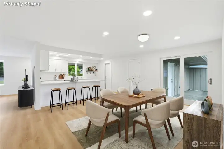 Dining area opens to the kitchen & living room, featuring a large sliding glass door to your entertainment size patio.