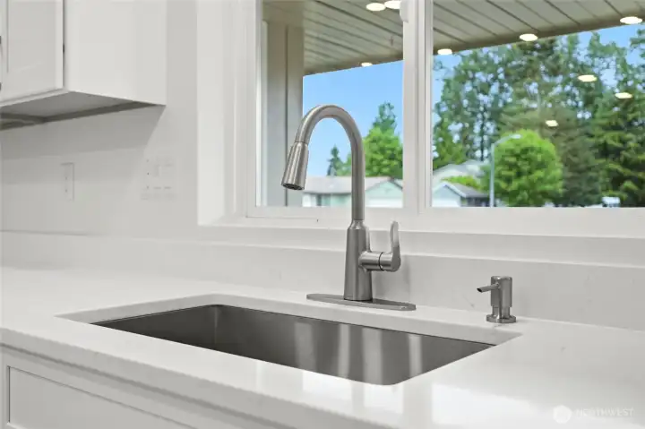 New under-mount stainless steel & new faucet.