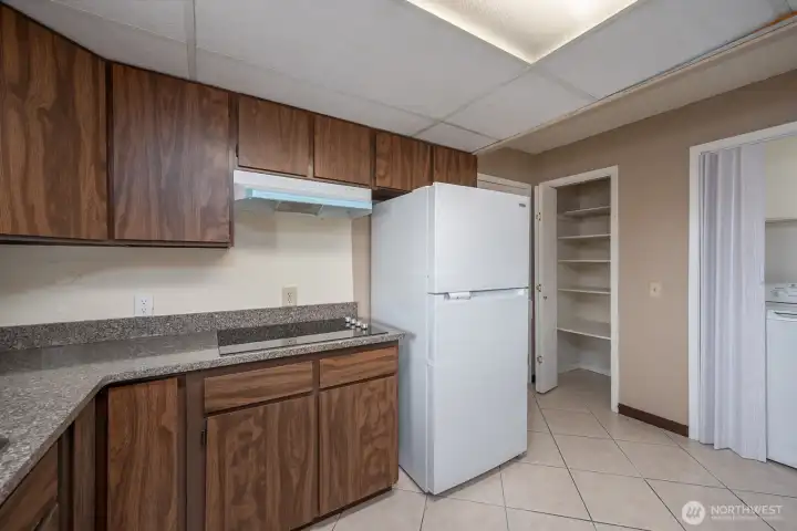 Kitchen with new quartz counters and appliances