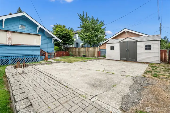 Outbuilding and parking pad