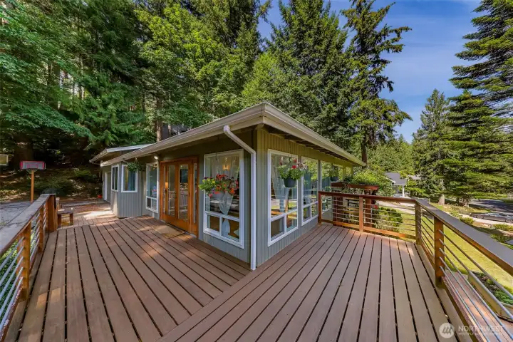 Large wrap around deck offers seamless indoor-outdoor living.