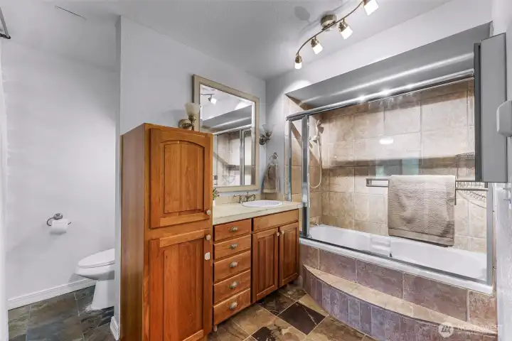 Spacious primary bedroom with soaking tub.