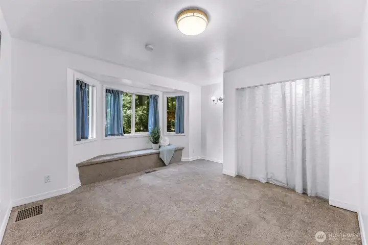 Secondary bedroom with window seat/storage.