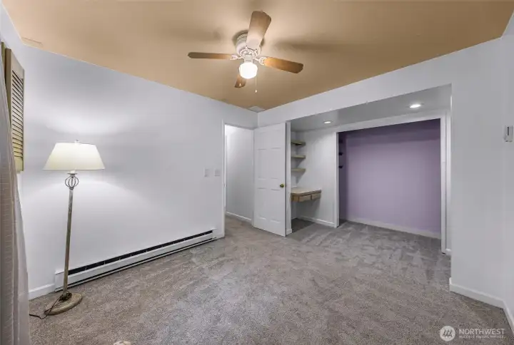 Third bedroom with built in desk and shleving.