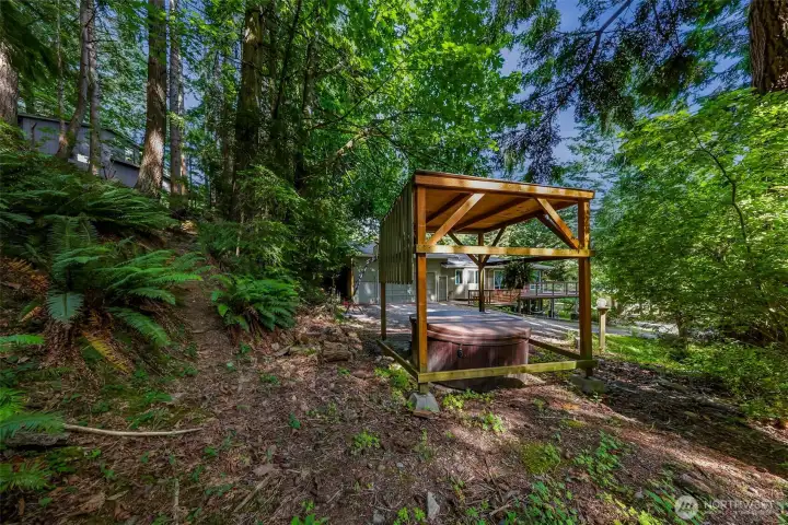 Covered hot tub for year-round enjoyment.