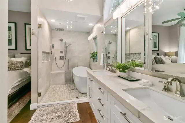 GORGEOUS! Slab Top Dual Sink Vanity, Soaking Bath Set within the Enclosed Custom Shower.