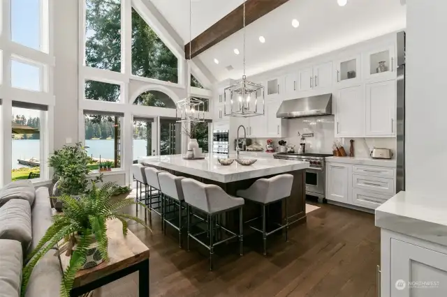 Absolutely Stunning Kitchen! Grand Porcelain Slab Island, Custom Stacked Wood Cabinetry w/ Undermount Lighting!