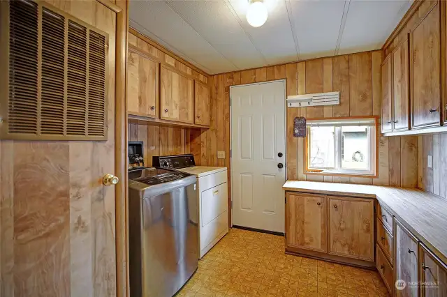 Laundry room with door to private back deck.