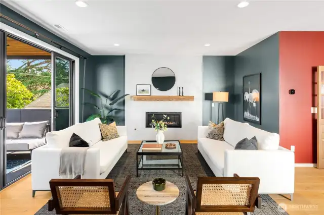 Comfortable living room complete with custom mantle-piece and convenient gas fireplace.