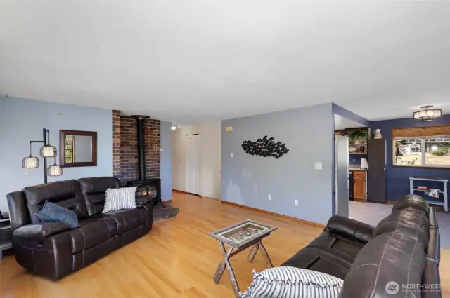 The propane stove is perfect for keeping you warm all winter. You can easily access the kitchen on your right, a great space for meal prep and family gatherings. Down the hall, there are three bedrooms that make for a peaceful retreat.