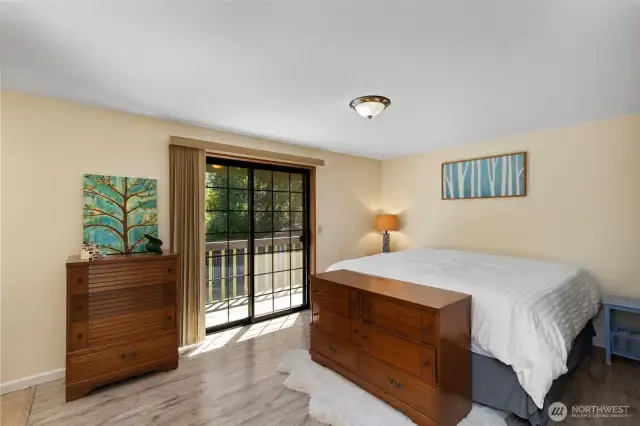 A roomy Primary Bedroom offering space for a King-sized bed, two nightstands, and additional furniture or seating.