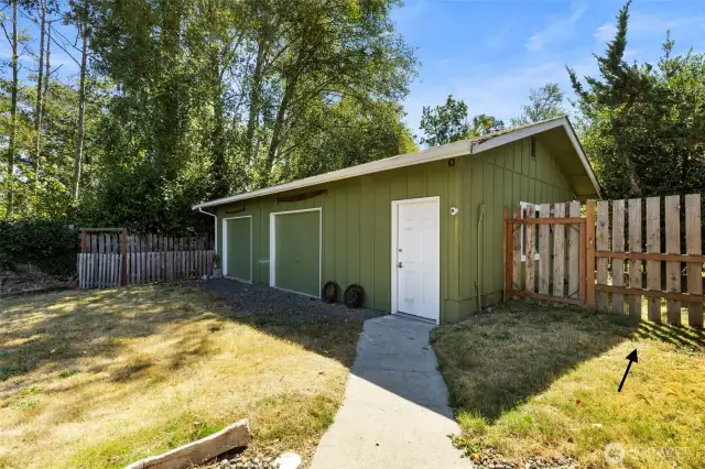 Imagine the added benefit of a 680 sq ft detached two-car garage and workshop, perfect for projects or extra storage. Plus, a section of the fence can be easily removed for convenient lawnmower access.