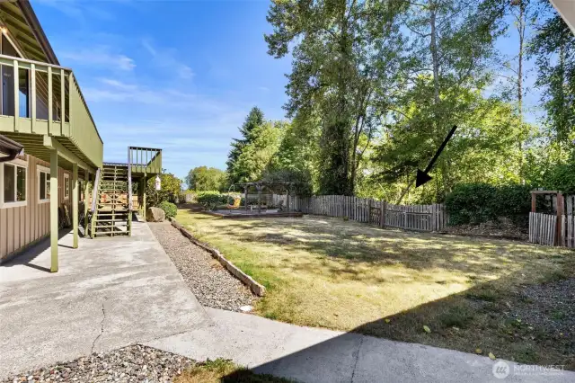 The back gate opens to Daria Lane providing access to the detached garage.