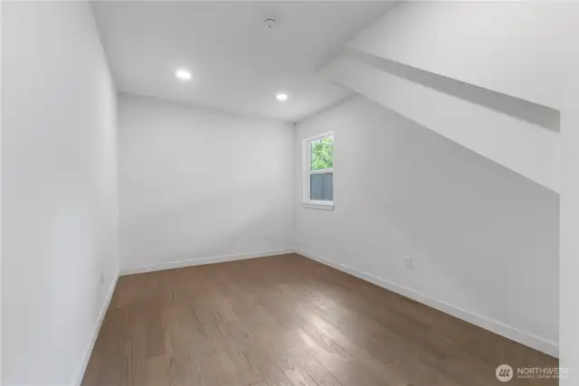 First floor bedroom in the additional living space on right side of garage building.