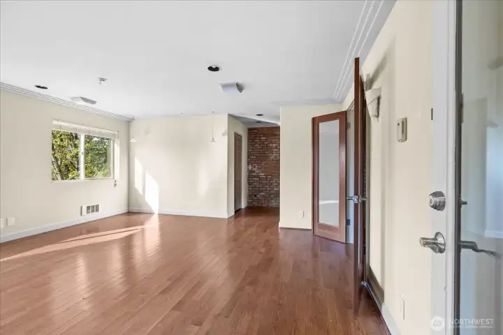 Upper-level flex space with hardwood floors, skylights, and a half bath - ideal for an office, studio, or creative retreat