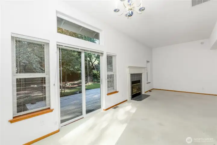 Set just off the main living space, the dining area invites you to slow down and settle in. Framed by expansive windows, this is where the outside becomes part of everyday living—soft forest views, filtered light drifting in at just the right moments, and a natural backdrop that shifts with the seasons.