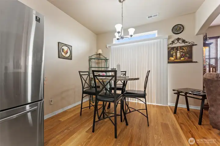 Comfortable dining room. The silver fridge does not stay with the home.